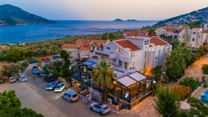 an aerial view of a building with cars parked in a parking lot at Kalkan Suite 102 in Kas