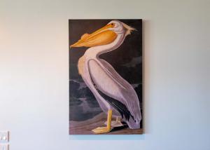 a painting of a pelican hanging on a wall at 5 BEDROOM BEACHFRONT CONDO - 2nd Floor in South Padre Island
