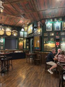 a group of people sitting in a bar at villa casa Aymlo in Torre-Pacheco