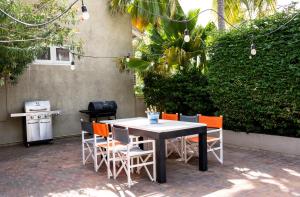 a table and chairs sitting on a patio at Windmill Apartments Curacao in Willemstad