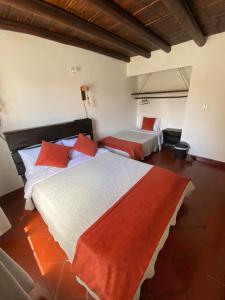 Postel nebo postele na pokoji v ubytování Hospederia Montano Alto