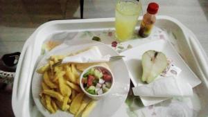 a tray of food with french fries and a drink at Talitha Accommodation in Lilongwe