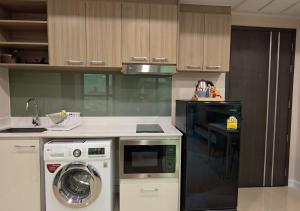 Η κουζίνα ή μικρή κουζίνα στο Dusit Grand Condo View Jomtien