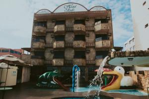 a water park in front of a hotel room at Hotel da Lea in Guarapari