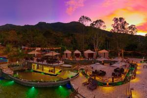 an aerial view of a resort at sunset at Hotel Termales La Montaña in Ahuachapán