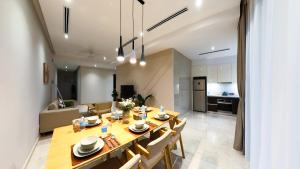 a dining room and kitchen with a table and chairs at TM Persiaran Stonor KLCC - MK HOME in Kuala Lumpur