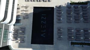 a sign on the side of a building with chairs at SIA in Odyssey Pool & Spa Resort in Năvodari