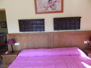 Posteľ alebo postele v izbe v ubytovaní Hacienda Doña Lola