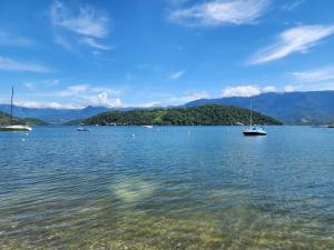 a large body of water with boats in it at Maritacas Angra in Angra dos Reis