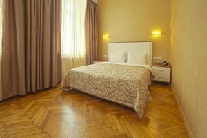 Кровать или кровати в номере Apart Hotel Kvartira 1