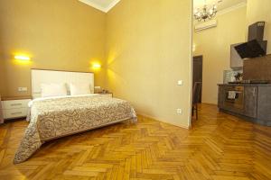 Кровать или кровати в номере Apart Hotel Kvartira 1