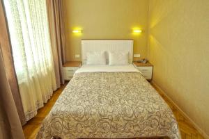 Кровать или кровати в номере Apart Hotel Kvartira 1