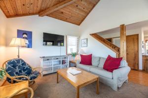 a living room with a couch and a table at Serenity in Duck D4118 - 3 Min Walk to the Beach, Community Pool! in Duck