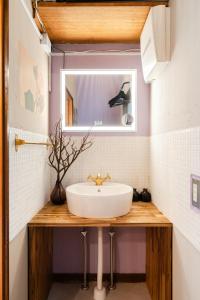 a bathroom with a sink and a mirror at EDO GATEI Sakura Biyori Stay in Tokyo +38 photos