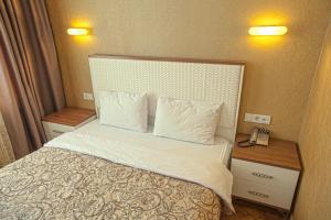 Кровать или кровати в номере Apart Hotel Kvartira 1