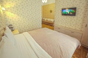 Кровать или кровати в номере Apart Hotel Kvartira 1
