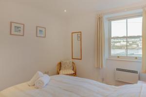 Ένα ή περισσότερα κρεβάτια σε δωμάτιο στο Glanmor South