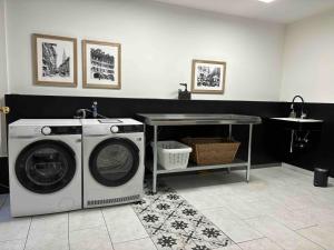 a laundry room with a washing machine and a table at Sunny Old Town Flat-Walk Everywhere-Sleeps 4 in Bern +51 photos