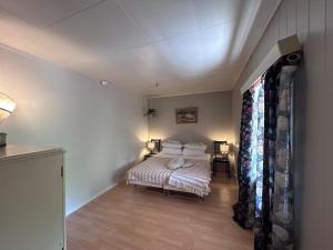 Postel nebo postele na pokoji v ubytování Snåsa Bryggehage - Top apartment