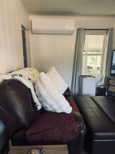 a pile of towels sitting on top of a couch at Cozy house by Crystal Creek in Cle Elum +6 photos