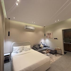 استديو أنيق بتصميم راقي tesisinde bir odada yatak veya yataklar