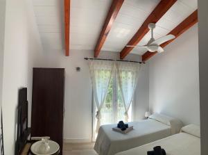 Ένα ή περισσότερα κρεβάτια σε δωμάτιο στο Casa La Jordana