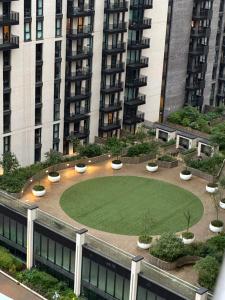 a garden in front of a large building at Luxury Stay ,London ,Wembley Stadium BOOk now in London