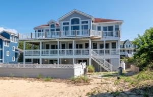 a large house on the beach at D3502 Sun King - Pool, Hot Tub, Pets OK, Oceanside in Duck