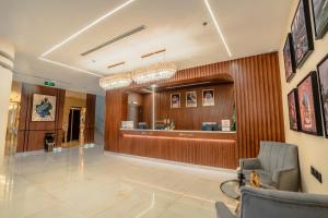 a lobby of a hospital with a waiting room at Grand Line Hotel in Tabuk