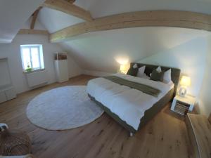 a bedroom with a large bed and a large rug at Chalet Bauer - 5 Sterne Ferienhaus im Altmühltal in Beilngries