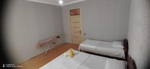 Ένα ή περισσότερα κρεβάτια σε δωμάτιο στο Gabala Mountains Villa