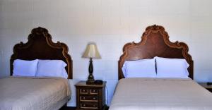 Postel nebo postele na pokoji v ubytování A Nights Inn