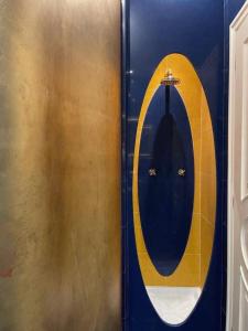 a bathroom with a round mirror and a sink at B&B Family Villa perfectly located in Rome +19 photos