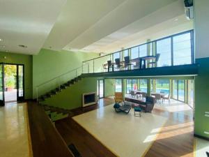 a large living room with a spiral staircase in a house at B&B Family Villa perfectly located in Rome