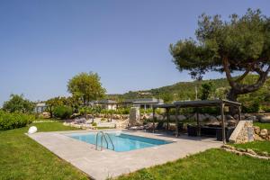 a pool in a yard with a gazebo at Alle Preziose Dimore in Tropea