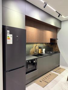 Køkken eller tekøkken på Piramit Tower New High-Tech Apartment + 7 billeder