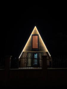 a house with a light on the roof at night at Tara Lux 2 in Mojkovac +4 photos
