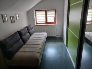 a living room with a couch and a window at Knez in Smederevo