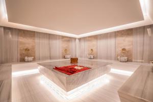 a large room with a fire pit in the middle of it at Prive Side Suite & Spa Hotel - Adults Only 16 Plus in Side +189 photos