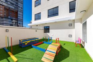 a playground on the roof of a building at MUV Residence - Centro | Gonzaga Stays in Curitiba