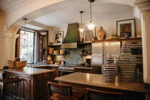 a kitchen with a table with two vases on it at Casa Florida in San Miguel de Allende