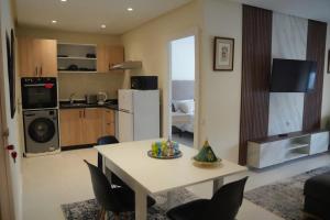 a kitchen and living room with a table and chairs at Rabat Easy Access in Rabat