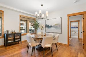 a dining room with a table and chairs at Timberstone Condo by Canadian Rockies Vacation Rentals in Canmore
