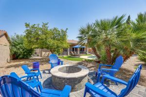 a group of blue chairs sitting around a fire pit at Extended-Stay Oasis Gilbert Getaway with Office! in Gilbert