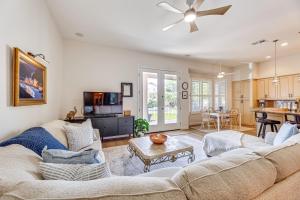 a living room with a couch and a table at Extended-Stay Oasis Gilbert Getaway with Office! in Gilbert