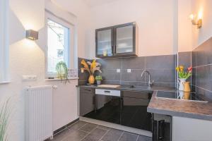 Kuchyň nebo kuchyňský kout v ubytování Stylische Unterkunft in Essen in Nähe von Messe und City + 7 fotografií