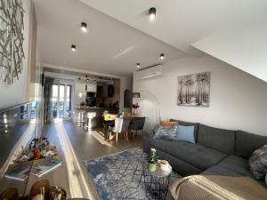 a living room with a couch and a table at Weekend House Alsóörs in Alsóörs