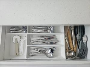 a drawer filled with utensils in a kitchen at Moj dom Petrićevac in Banja Luka +2 photos