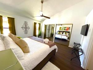 a bedroom with a bed and a couch and a mirror at Phoenix Home - Oasis by the Hills in Phoenix