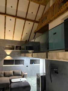 a living room with a couch and a table at Lux Escape Pridolci in Kozica